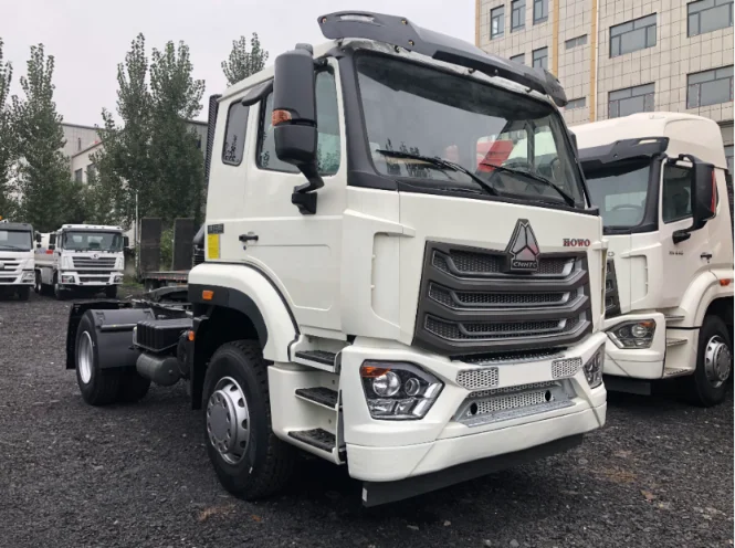 White HOWO tractor truck, front view.