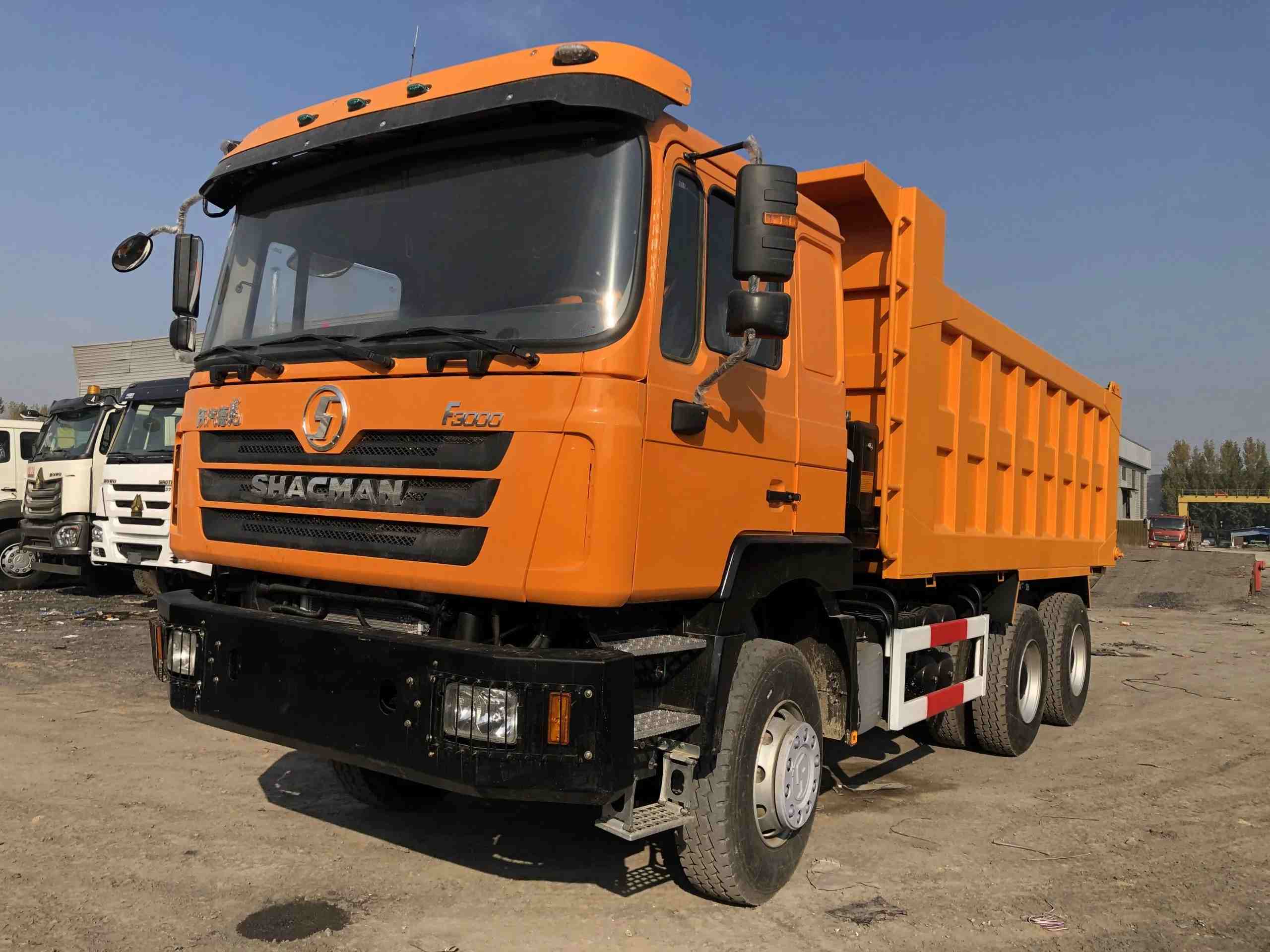 Orange Shacman F3000 dump truck, construction vehicle