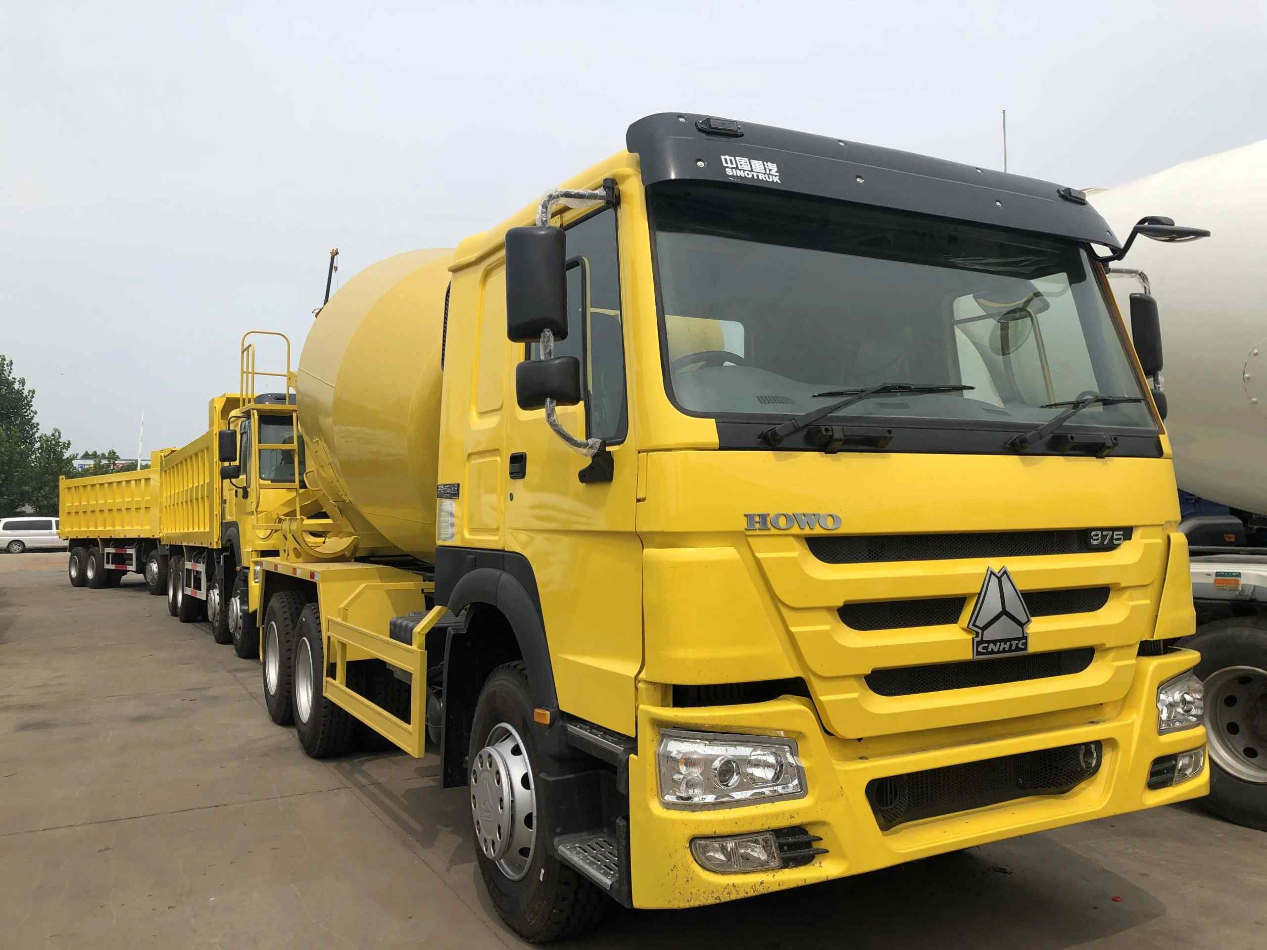 yellow concrete mixer truck